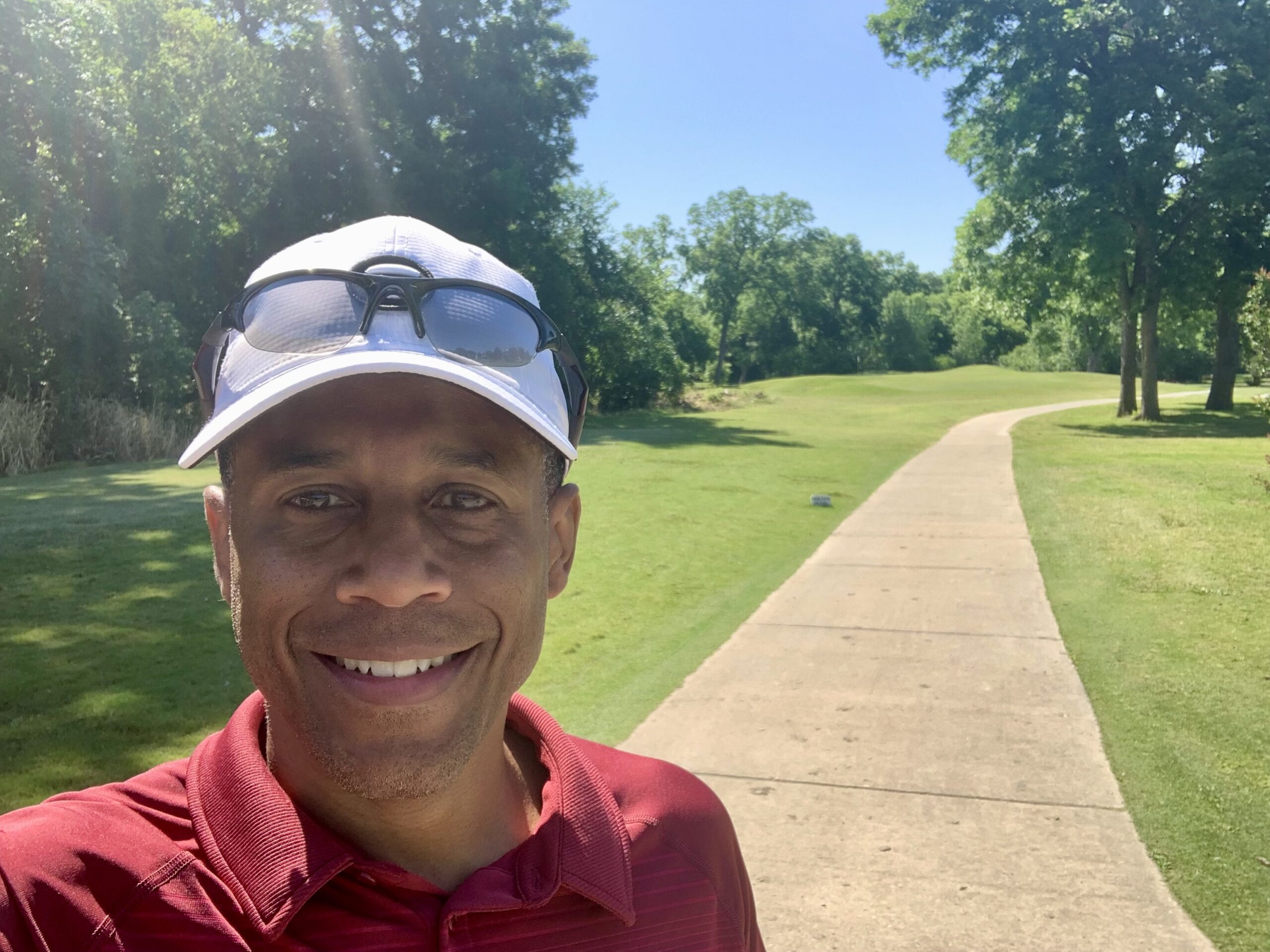 A photo of Marty Ezelle, Dallas financial advisor and actor, smiling in front the camera.